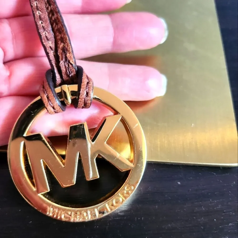 Michael Kors Gold Logo Pendant with Brown Cord